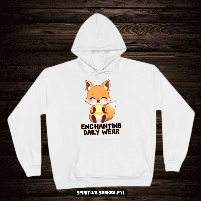 Funny Hoodie: A cuddly kawaii fox cradling a glowing orb, radiating warmth and gentle magic.