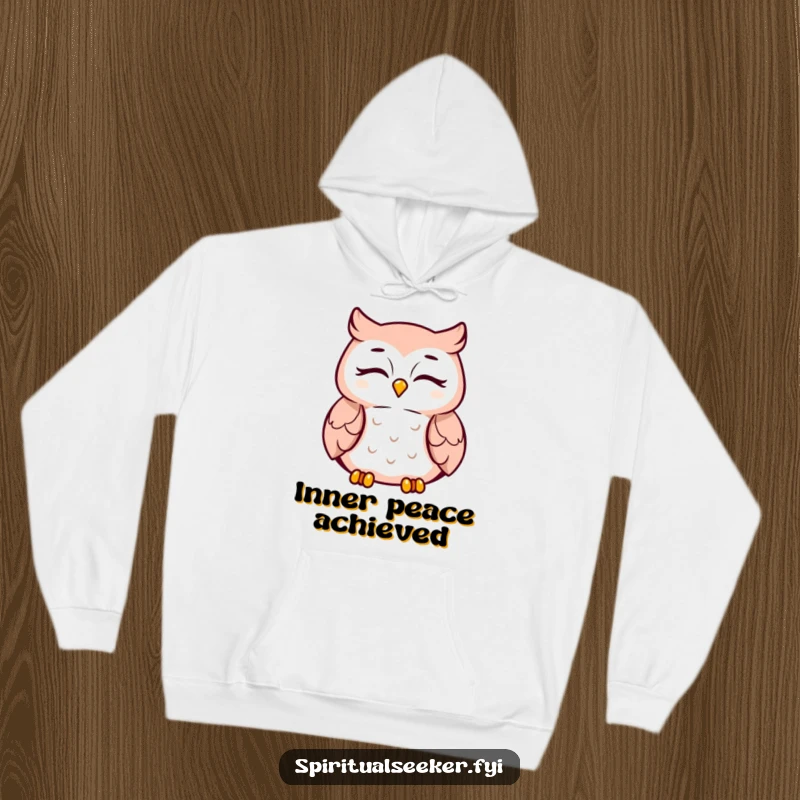 Funny meditating owl hoodie, peaceful smiling character, promoting relaxation and warmth. Great for cozy wear.