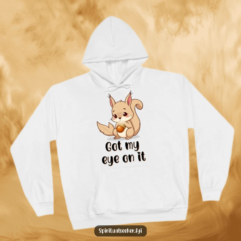 Funny squirrel hoodie with a curious squirrel eyeing a bright, magical acorn with fascination. Cozy and whimsical.