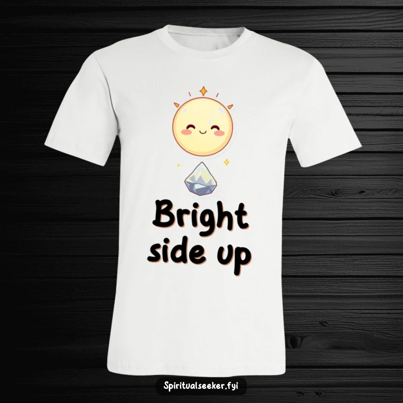 Funny t-shirt featuring a smiling celestial body happily floating above a tiny, sparkling crystal, radiating positive cosmic vibes.